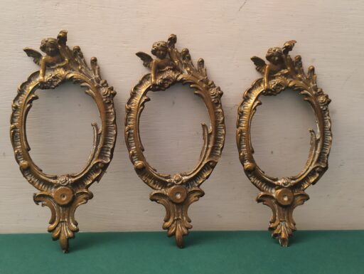 Cornici in ottone con putti