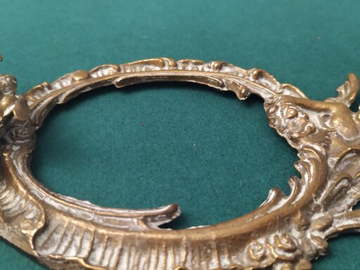 Cornici in ottone con putti